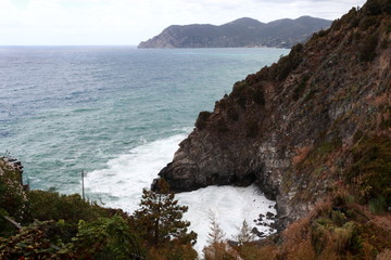 waves crashing on the rocky coast of northern Italy c