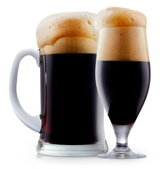 Mug of frosty dark beer with foam isolated on a white background