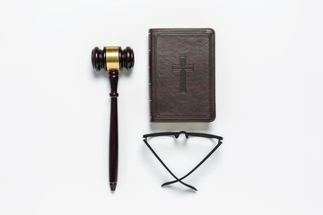 Bible book, gavel wooden on white