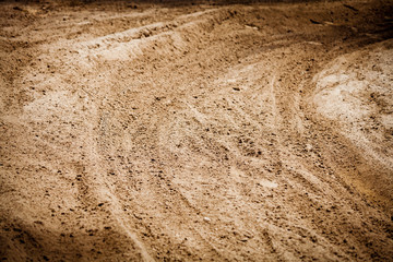 Wheel tracks print on countryside dirt route, background image
