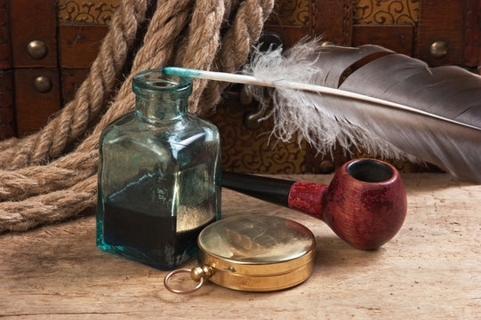 old pocket watch and inkwell