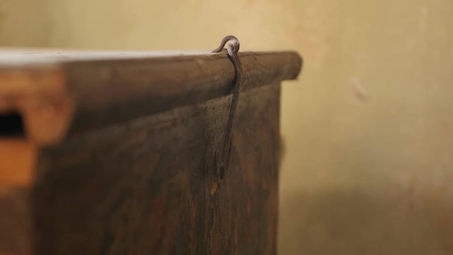 Old wooden chest closing close-up footage - Hand closes weathered dusty furniture inside abandoned house