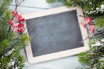 Christmas chalkboard and fir tree with snow