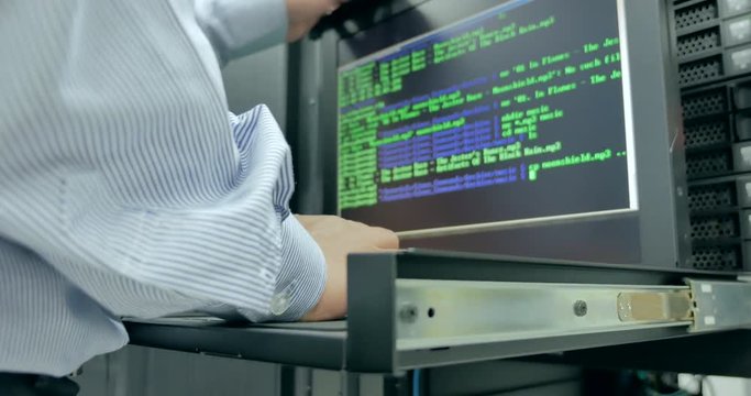 Close up administrator working in data center