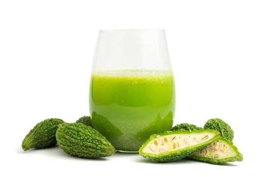 Herbal juice with bitter melon or bitter gourd on white background.