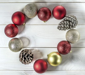 Christmas and New Year decorations - yellow and red balls, cones lined with heart