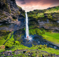 Colorful morning view of Kvernufoss waterfall