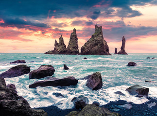 Picturesque seascape of Reynisdrangar cliffs in the Atlantic ocean.