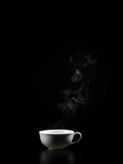 Hot tea on a black background. Autumn and winter drinks
