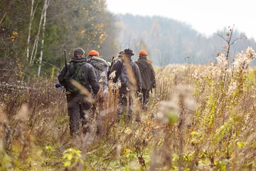 Foto op Aluminium group of hunters during hunting in forest, chase hunting © gsshot