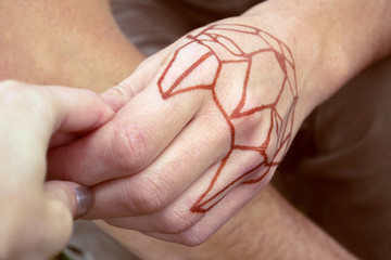 tattoo hands are kept together