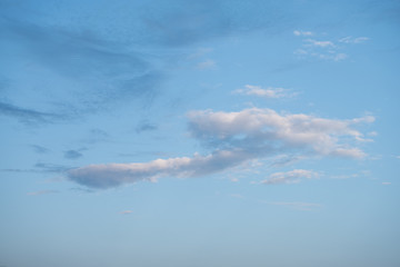 Naklejka na ściany i meble White single cloud in the blue sky.