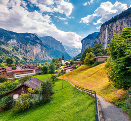 Sunny summer view of great waterfall in Lauterbrunnen village. Splendid outdoor scene in Swiss...
