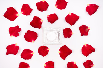 Dear love, roses, special occasions, along with condoms, isolated background.