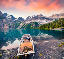 Picturesque summer sunrise on the unique Oeschinensee Lake. Splendid morning scene in the Swiss...