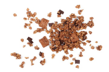 Crunchy granola, muesli pile with chocolate isolated on white background, top view