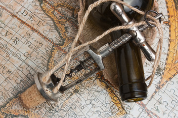 bottle of wine and a corkscrew