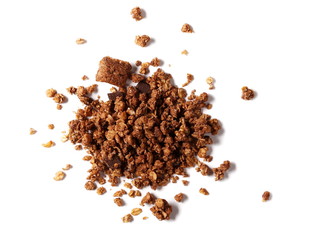 Crunchy granola, muesli pile with chocolate isolated on white background, top view