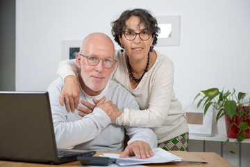 Happy mature couple in love, in their home