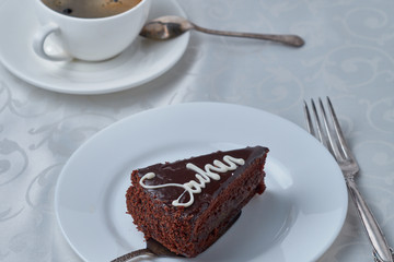 Delicious cake with coffee on a white background