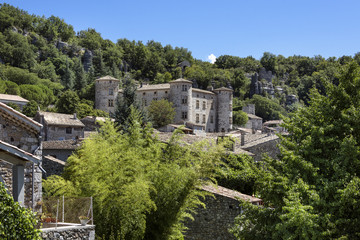Fototapeta na wymiar France, Vogue, river Ardeche: Skyline with ancient stone castle and homes of the medieval town.