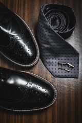 Fototapeta na wymiar Male accessories. Shoes with tie and cuff