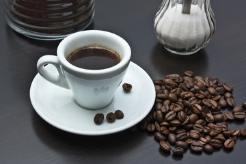 pile of coffee beans and a cup