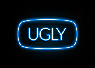 Ugly  - colorful Neon Sign on brickwall