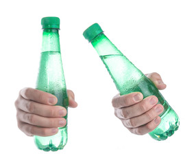 Green bottle of water in the hand isolated on white background,Front view