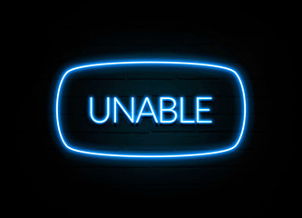 Unable  - colorful Neon Sign on brickwall