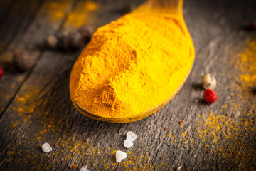 Spices. Spice in Wooden spoon. Herbs. Curry, Saffron, turmeric, cinnamon and other on a wooden rustic background. Pepper. Large collection of different spices and herbs. Salt, paprika.