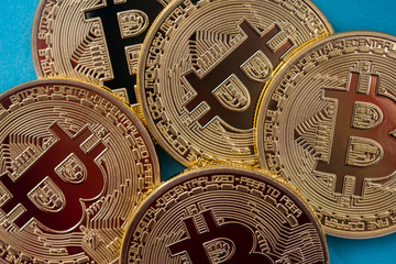 new virtual money - gold bitcoin isolated on blue