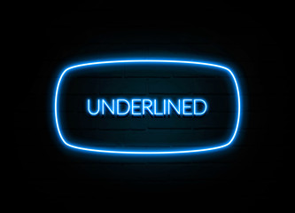 Underlined  - colorful Neon Sign on brickwall