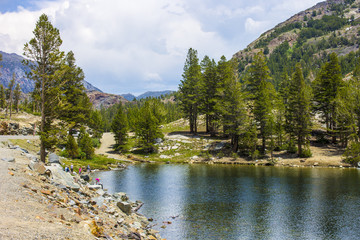 Views of Tenaya Lake, an alpine lake in Yosemite National Park, California, located at an elevation...