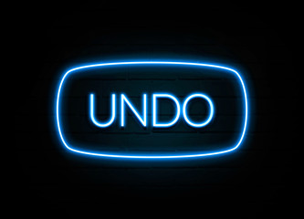 Undo  - colorful Neon Sign on brickwall