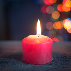 Christmas Candle over blurred christmas Bokeh background,Space for text.