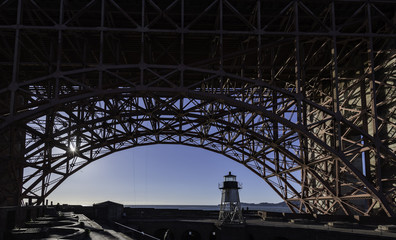 Lighthouse under bridge structure