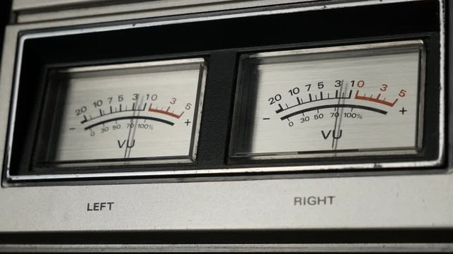 Standard volume level indicator shallow DOF footage - Close-up of analog VU meter scale 