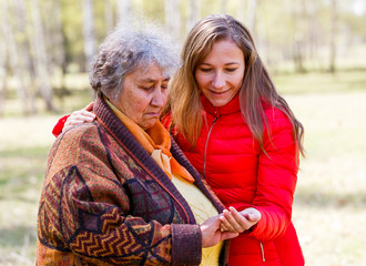 Happy elderly woman with her daughter