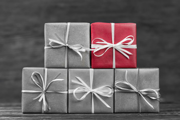 One red gift box among black and white