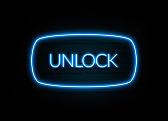 Unlock  - colorful Neon Sign on brickwall