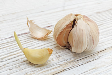 Garlic on a white wooden board