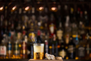 Hot apple cider served with dried apple and cookie