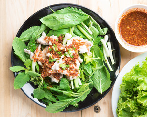 Spicy stir fried pork stips with pepper chilli on wood,thai food