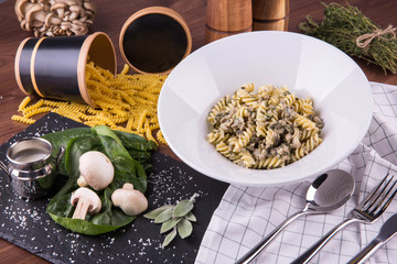 Paste with a duck in creamy and mushroom sauce with spinach