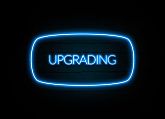 Upgrading  - colorful Neon Sign on brickwall