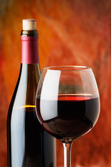 bottle and glass of red wine