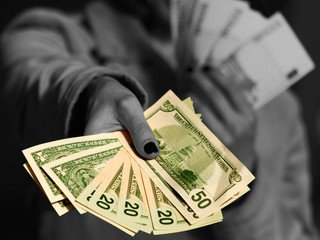 Woman giving dollars money