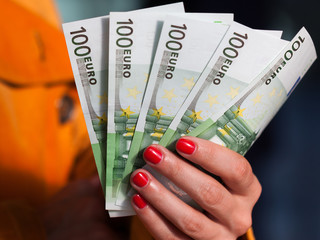 Woman's hand holding money