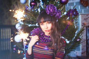 Beauty glamor Woman celebrating Christmas, wearing a knitted sweater.